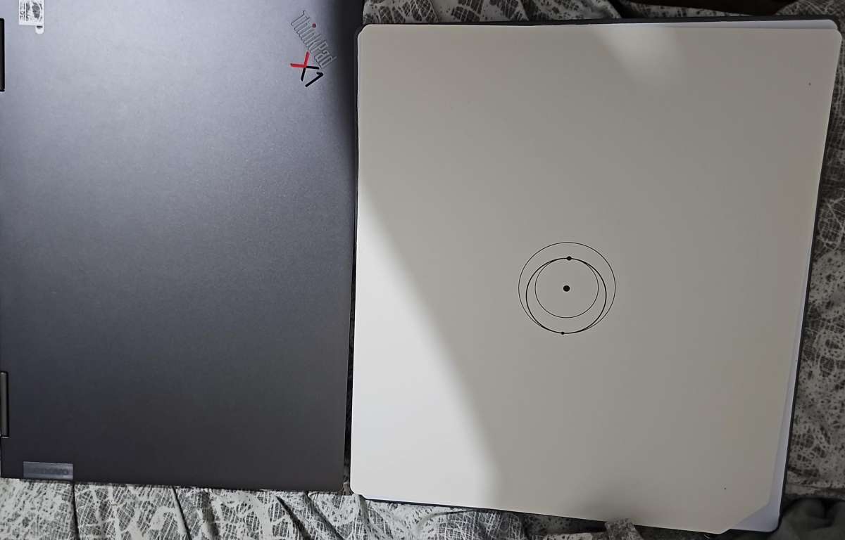 Starlink Mini Next to Lenovo X1 Yoga Laptop